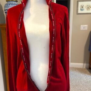 Cuffed sleeves. Silky feel to this item. Rich maroon color